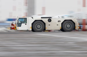pushback-truck-in-moving-at-airport-2021-09-24-19-59-27-utc-1